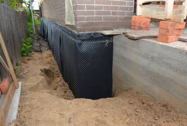 Happy homeowners after waterproofing job in Collegeville